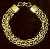 gold lace bracelet on black brighter.jpg (15002 bytes)